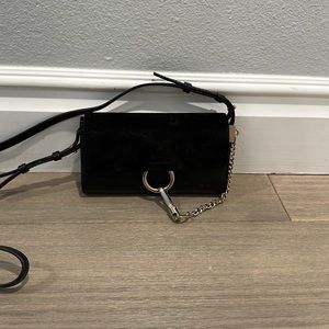 Authentic great condition black wallet on chain. Minor wear on the suede